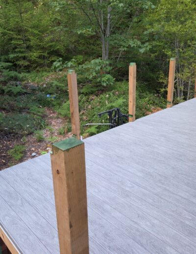 Construction stage of Sienna pressure-treated railings by Steve’s Woodworking in Shawnigan Lake, showing posts before top rails were added.